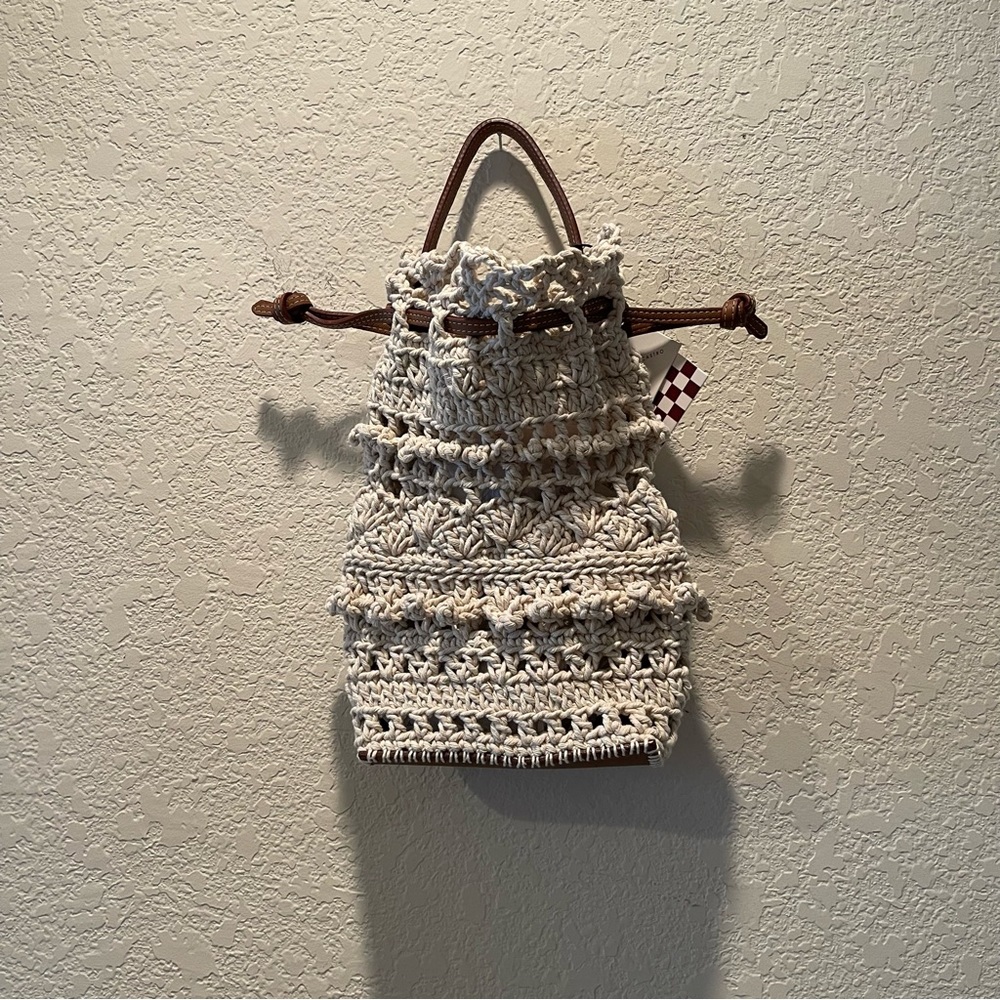 Adriana Castro “La Rossy” Mini in leather and crochet drawstring handbag